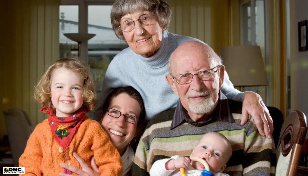 Multigenerational family portrait featuring a grandmother, grandfather, mother, young girl, and baby, emphasizing the importance of family living in custom homes designed for multigenerational needs in the Fraser Valley.